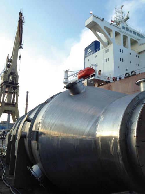 In the port lies a scrubber, a soot filter for ships, ready to be installed